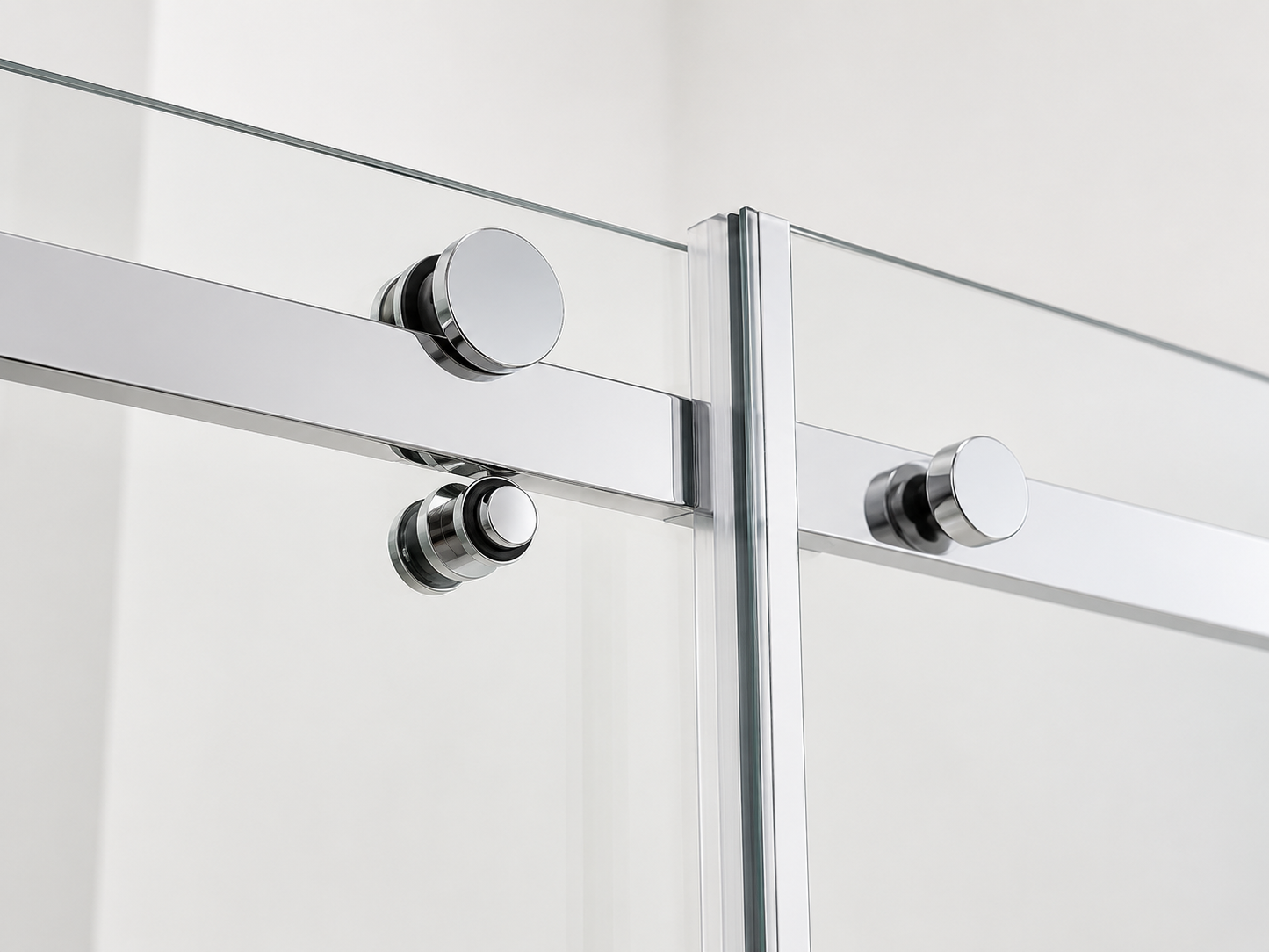 Glass shower enclosure with chrome fixtures on a white background
