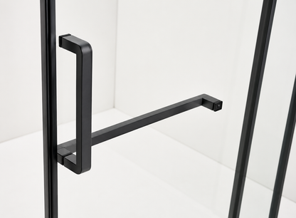 Black metal handle on a glass door with a white background