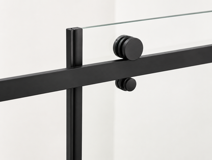 Black metal railing with glass panels on a white background