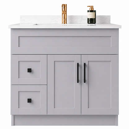 Gray bathroom vanity with white countertop, gold faucet, and black soap dispenser on a white background