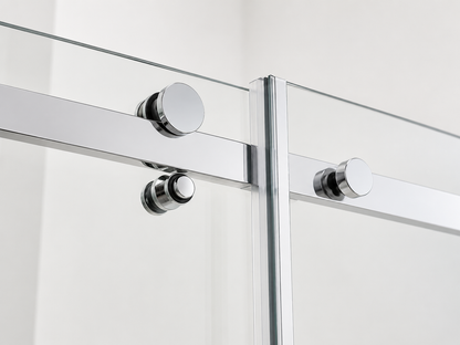 Glass shower enclosure with chrome fixtures on a white background