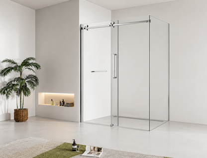 Modern bathroom with a glass shower enclosure, plant, and decorative items.